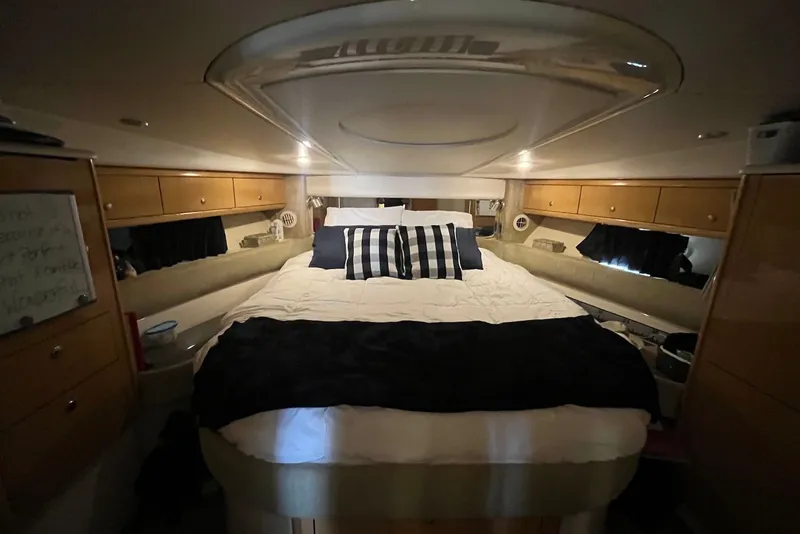 Slide: The Image of Luxurious cabin interior of 2004 Maxum 4200 SY yacht with cozy bedding. - 12