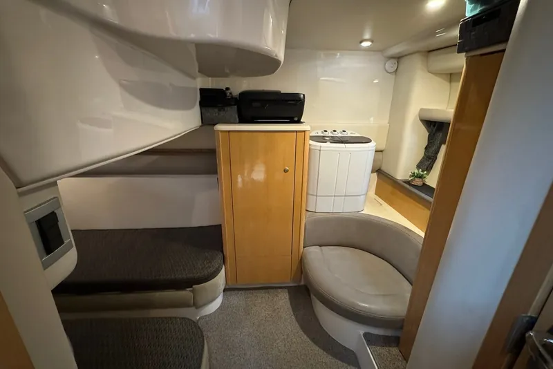 Slide: The Image of Interior of 2004 Maxum 4200 SY yacht with seating, cabinetry, and washing machine. - 10