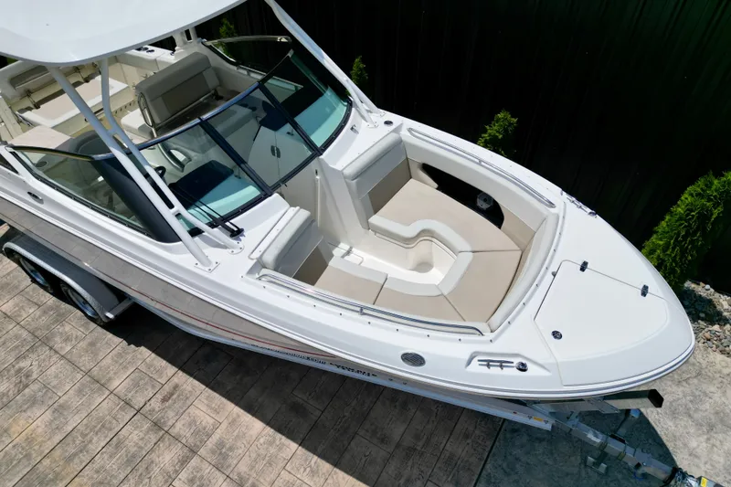 Slide: The Image of 2025 Boston Whaler 240 Vantage boat on trailer, top view, showcasing spacious seating. - 14