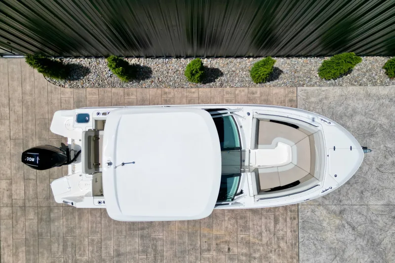Slide: The Image of Top view of 2025 Boston Whaler 240 Vantage boat docked on concrete. - 4
