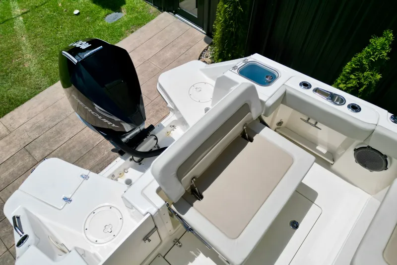 Slide: The Image of 2025 Boston Whaler 240 Vantage boat interior with seating and outboard motor. - 7