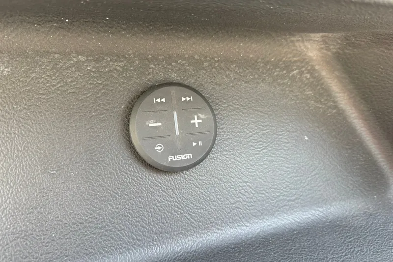 Slide: The Image of Control panel on 2027 Monterey Elite 27 OB boat dashboard, featuring Fusion audio controls. - 16
