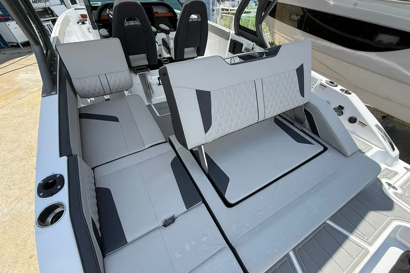 Slide: The Image of 2027 Monterey Elite 27 OB boat interior with sleek, modern seating and stylish design. - 25
