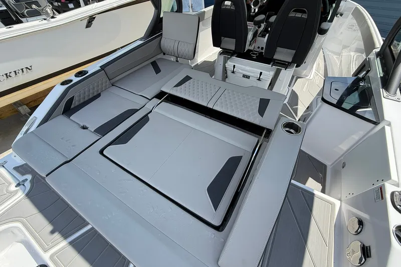 Slide: The Image of 2027 Monterey Elite 27 OB boat interior with adjustable seating and modern design. - 26