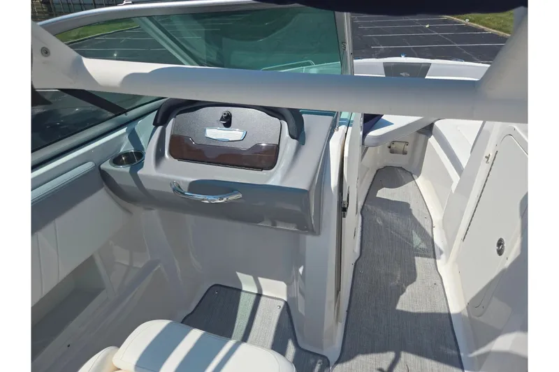 Slide: The Image of 2022 Chaparral 23 SSi boat interior with modern dashboard and seating area. - 14