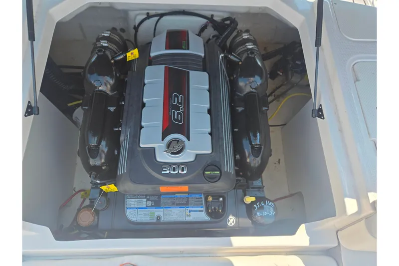 Slide: The Image of 2022 Chaparral 23 SSi boat engine compartment with 6.2L 300 horsepower engine. - 25