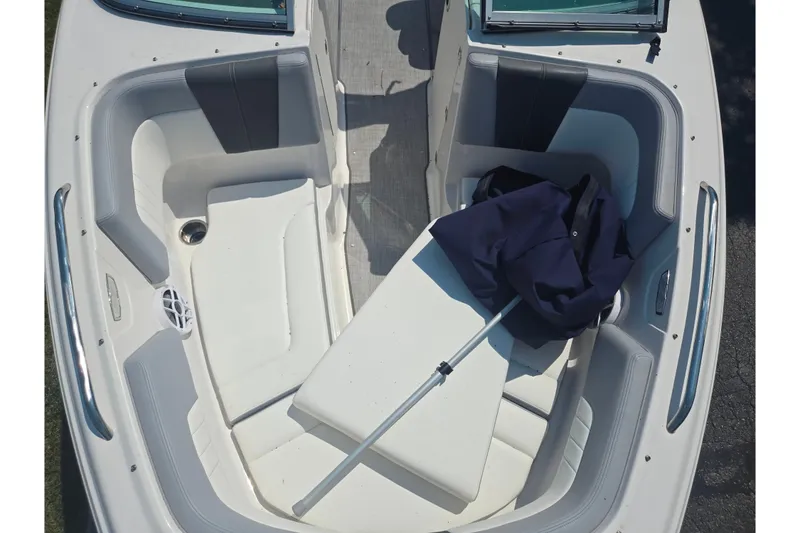 Slide: The Image of 2022 Chaparral 23 SSi boat interior with seating and storage area. - 20