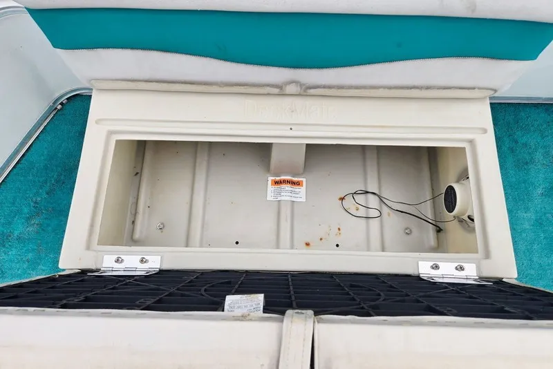 Slide: The Image of Open storage compartment on 1998 Sun Tracker Fishin' Barge 21 Signature Series boat. - 27