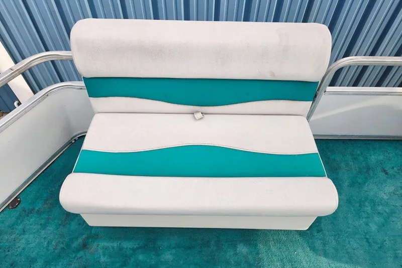Slide: The Image of White and teal seating on 1998 Sun Tracker Fishin' Barge 21 Signature Series boat. - 28