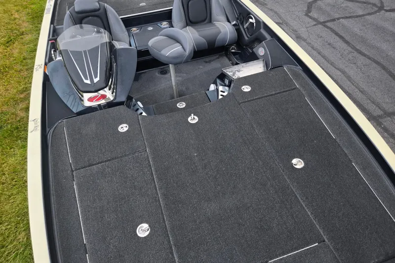 Slide: The Image of 2016 Ranger Z521 Comanche boat interior with seating and storage compartments. - 19