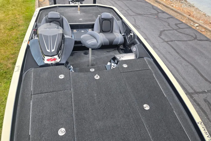 Slide: The Image of 2016 Ranger Z521 Comanche boat interior with dual seats and carpeted deck. - 18
