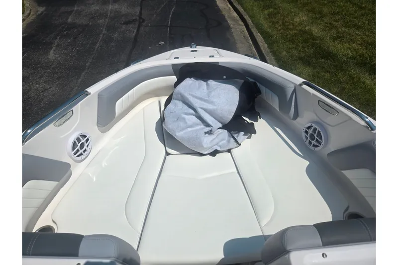 Slide: The Image of 2023 Chaparral 21 SSi boat interior with seating and speakers. - 19