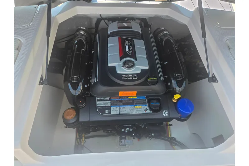 Slide: The Image of 2023 Chaparral 21 SSi boat engine compartment with Mercury 4.5L 250 HP engine. - 26