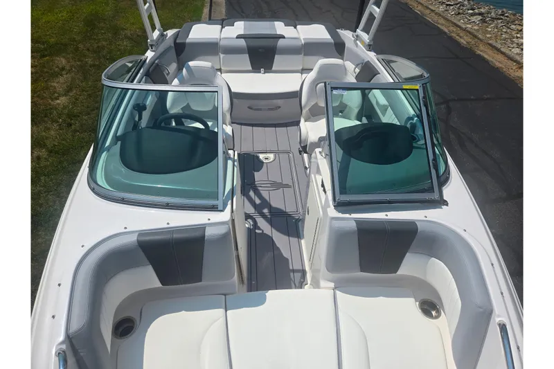 Slide: The Image of 2023 Chaparral 21 SSi boat interior with open windshield and seating area. - 22