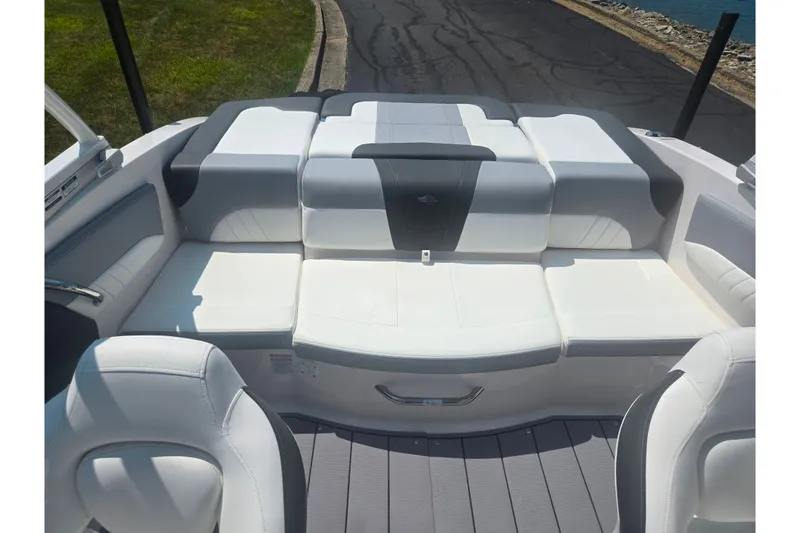 Slide: The Image of 2023 Chaparral 21 SSi boat interior with white and gray seating. - 24