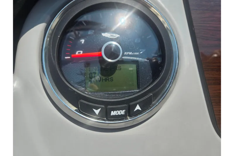 Slide: The Image of Close-up of 2023 Chaparral 21 SSi tachometer displaying engine hours and RPM. - 29