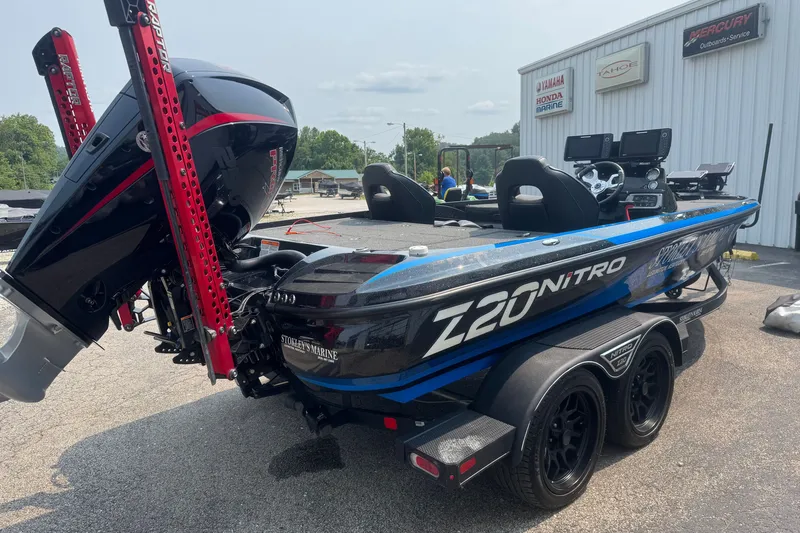 Slide: The Image of 2022 Nitro Z20 boat with powerful engine, parked outside marine service center. - 4