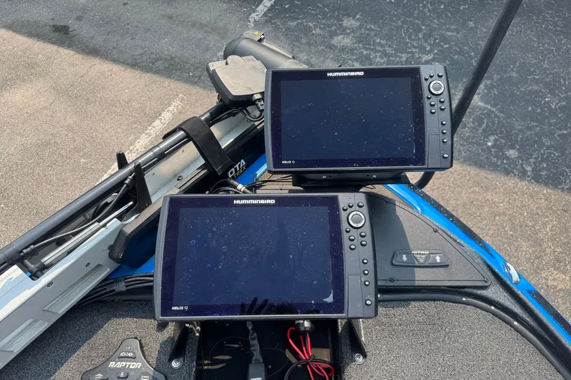 Slide: The Image of 2022 Nitro Z20 boat dashboard with dual Humminbird fish finders and trolling motor controls. - 7