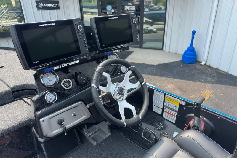 Slide: The Image of Interior of a 2022 Nitro Z20 boat with dual Humminbird Helix 10 displays. - 13