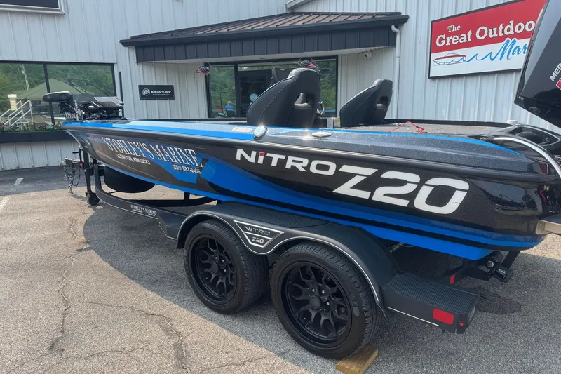 Slide: The Image of 2022 Nitro Z20 boat on trailer outside dealership, featuring sleek design and branding. - 3