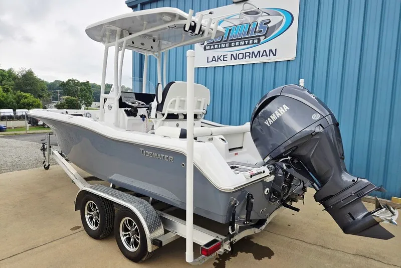 Slide: The Image of 2024 Tidewater 210 LXF boat with Yamaha engine on trailer at marine center. - 5