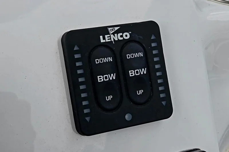 Slide: The Image of Lenco trim tab control on 2024 Tidewater 210 LXF boat dashboard. - 3