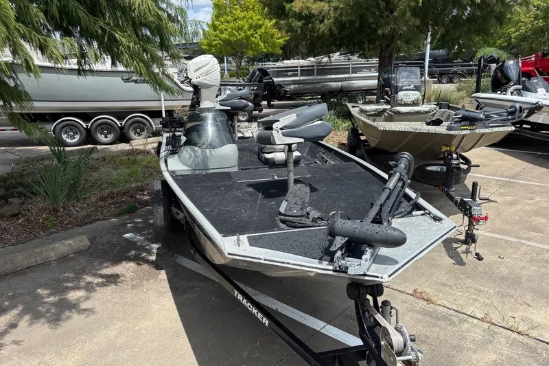 Slide: The Image of 2012 Tracker Pro 165 fishing boat parked on a trailer in a lot. - 23