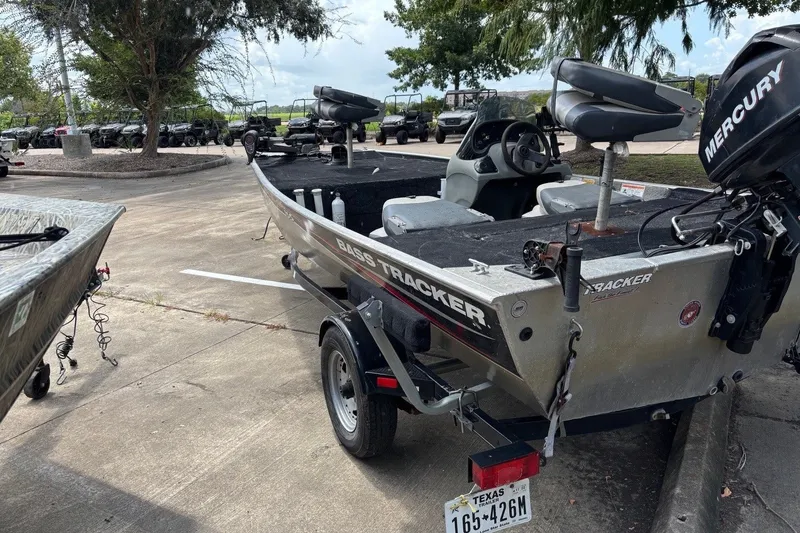 Slide: The Image of 2012 Tracker Pro 165 fishing boat with Mercury motor in parking lot. - 16