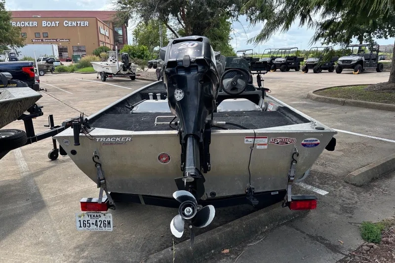Slide: The Image of 2012 Tracker Pro 165 boat with motor in parking lot near Tracker Boat Center. - 15