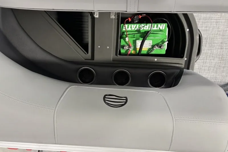 Slide: The Image of Sun Tracker Party Barge 16 DLX 2027 battery compartment with green Interstate battery. - 17
