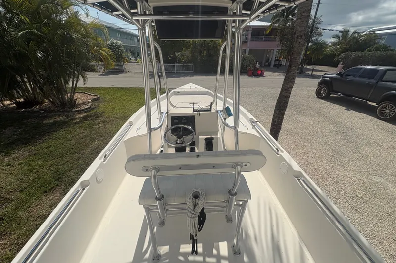 Slide: The Image of 2015 Bulls Bay 2200 boat interior with steering console, parked outdoors. - 13