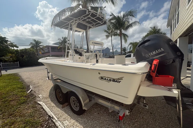 Slide: The Image of 2015 Bulls Bay 2200 boat on trailer with Yamaha engine, parked outdoors. - 6
