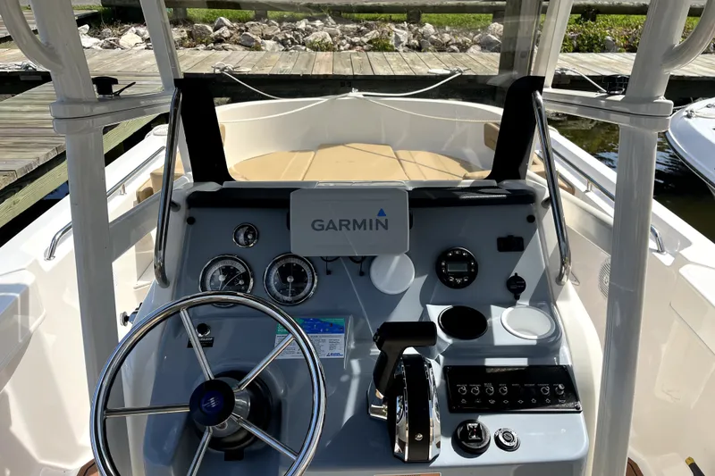Slide: The Image of 2024 Trophy CC22 boat dashboard with Garmin navigation system and steering wheel. - 3