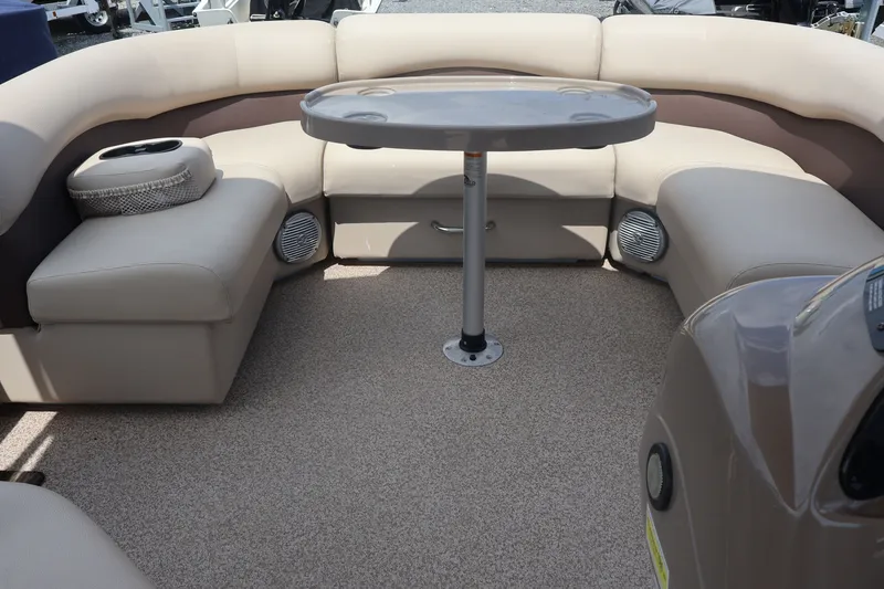 Slide: The Image of Interior of 2015 Palm Beach Ultra Sport 220 RL pontoon boat with seating and table. - 24