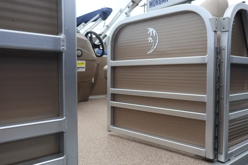 Slide: The Image of 2015 Palm Beach Ultra Sport 220 RL boat interior with steering wheel and gate. - 41