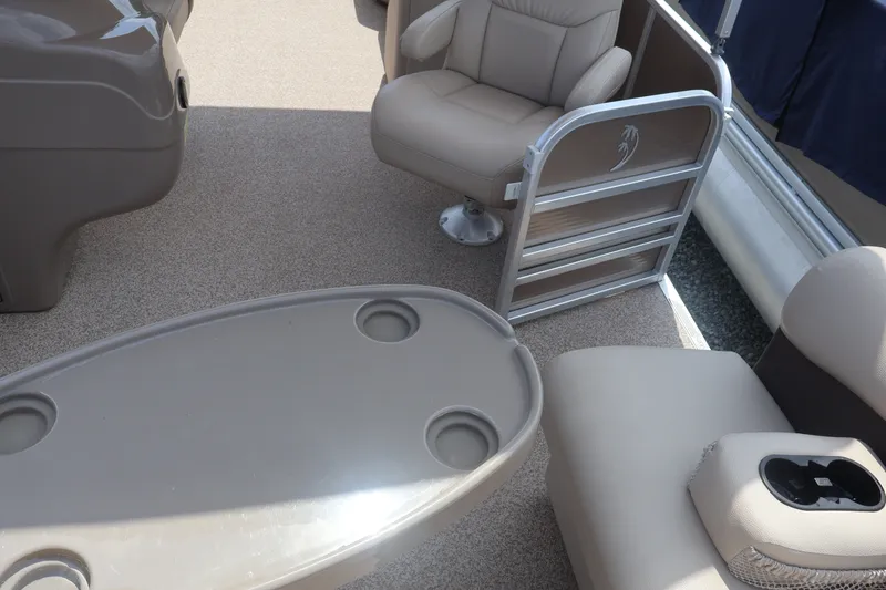 Slide: The Image of Interior of 2015 Palm Beach Ultra Sport 220 RL boat with seating and table. - 25
