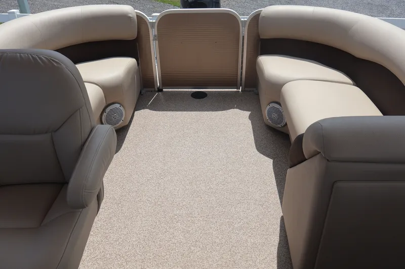 Slide: The Image of Interior of 2015 Palm Beach Ultra Sport 220 RL pontoon boat with beige seating. - 38