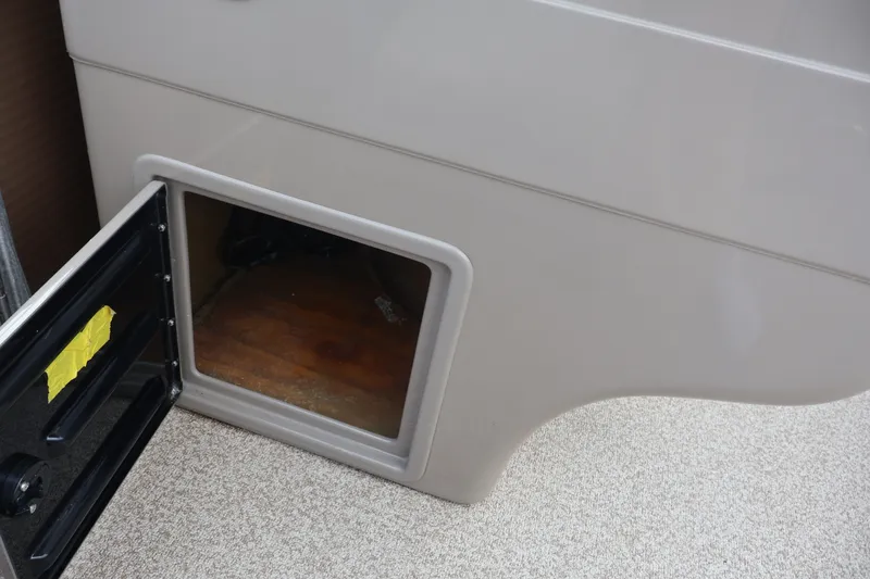 Slide: The Image of Open storage compartment in 2015 Palm Beach Ultra Sport 220 RL boat interior. - 27