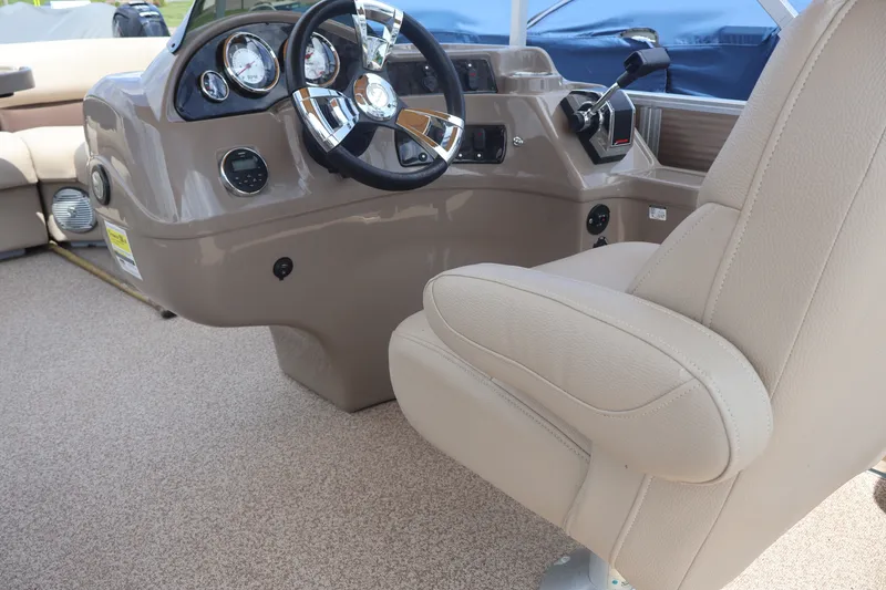 Slide: The Image of Interior of 2015 Palm Beach Ultra Sport 220 RL boat with steering wheel and captain's chair. - 32