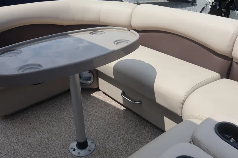 Slide: The Image of Interior seating of 2015 Palm Beach Ultra Sport 220 RL boat with table. - 18