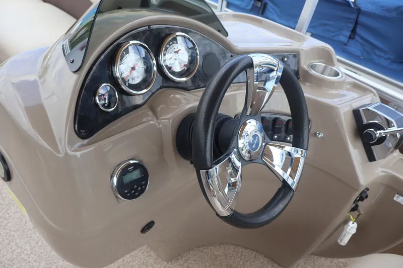 Slide: The Image of Steering console of 2015 Palm Beach Ultra Sport 220 RL boat with gauges and controls. - 30