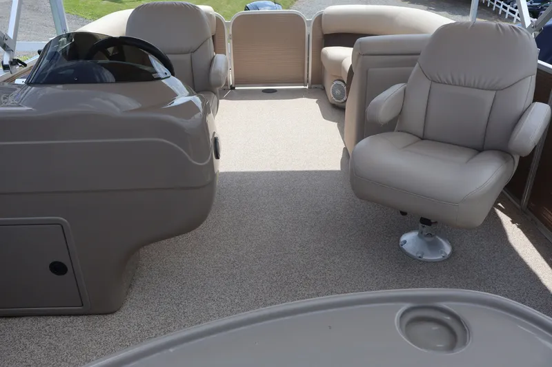 Slide: The Image of Interior of 2015 Palm Beach Ultra Sport 220 RL boat with beige seating. - 37