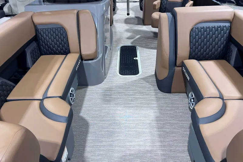 Slide: The Image of Luxurious interior of 2026 Sylvan L3 LZ DH boat with tan and black seating. - 4