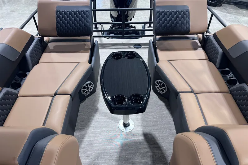 Slide: The Image of Luxurious seating area on 2026 Sylvan L3 LZ DH boat with sleek table and cup holders. - 17