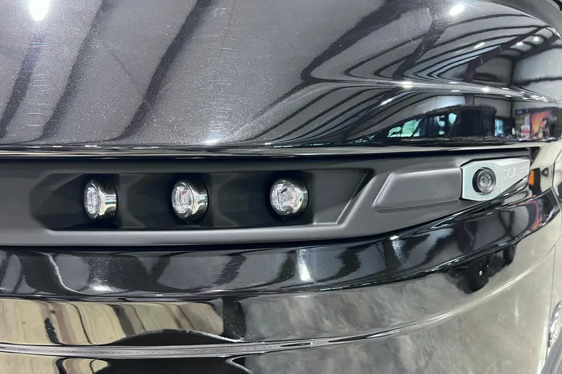 Slide: The Image of Close-up of 2026 Sylvan L3 LZ DH boat's sleek black exterior with LED lights. - 29