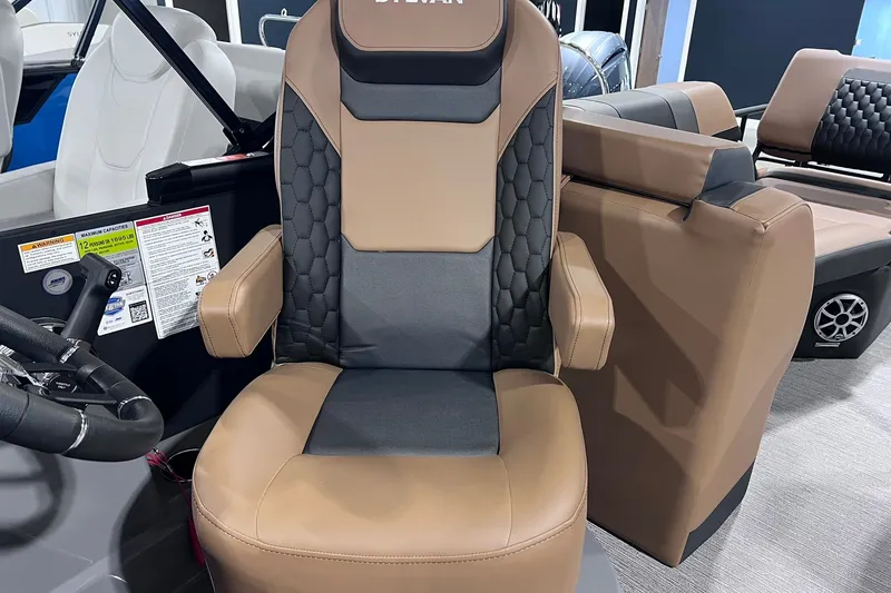 Slide: The Image of Captain's chair in 2026 Sylvan L3 LZ DH boat, featuring brown and black upholstery. - 8