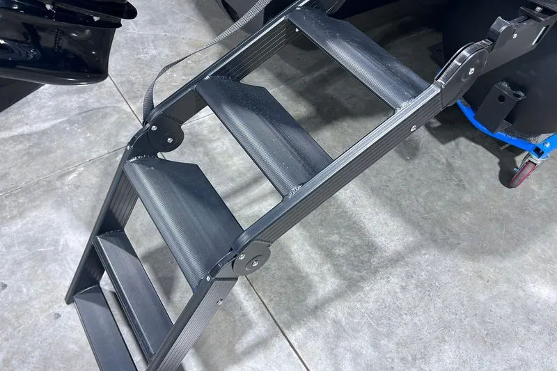 Slide: The Image of Folding metal steps of a 2026 Sylvan L3 LZ DH on a concrete floor. - 34