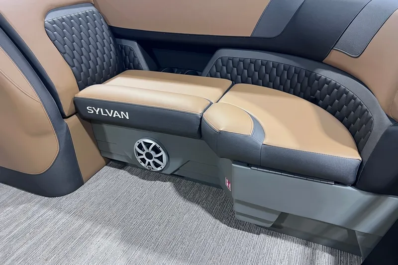 Slide: The Image of Luxurious seating in a 2026 Sylvan L3 LZ DH boat, featuring premium upholstery and integrated speaker. - 6