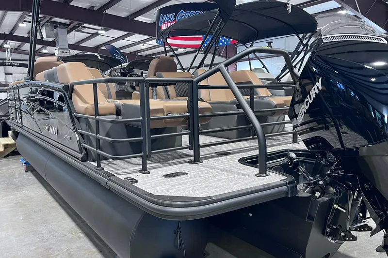 Slide: The Image of 2026 Sylvan L3 LZ DH pontoon boat with Mercury engine in showroom. - 3