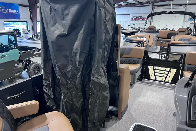 Slide: The Image of 2026 Sylvan L3 LZ DH pontoon boat interior with seating and canopy. - 23